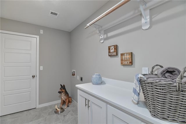 6118 Lewis Dr, Shawnee, KS 66226 - laundry room with hookup for an electric dryer, cabinet space, and washer hookup