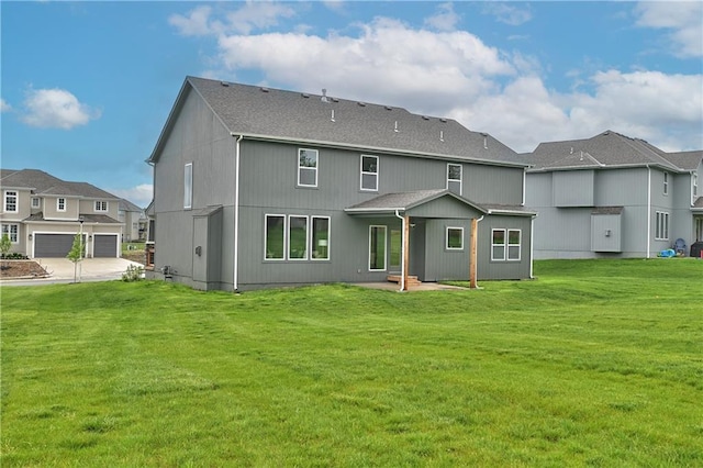 6118 Lewis Dr, Shawnee, KS 66226 - back of house with a yard, a shingled roof, a garage, a patio, and a residential view