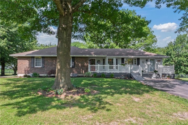 32204 Apple Hill Dr, Paola, KS 66071 - single story home featuring covered porch, brick siding, and a front yard