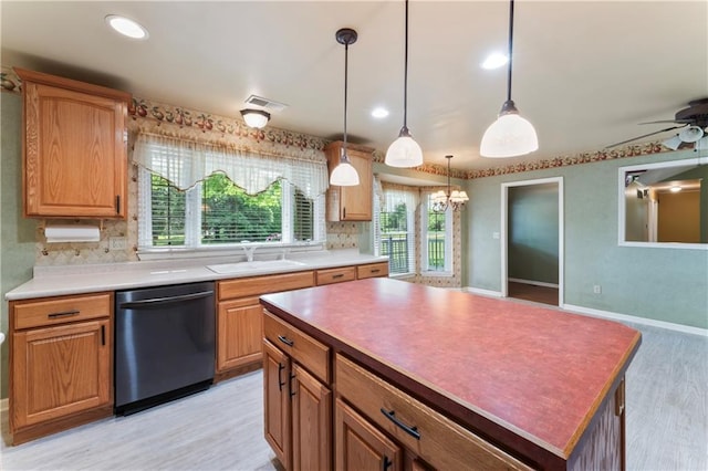 32204 Apple Hill Dr, Paola, KS 66071 - kitchen featuring dishwashing machine, tasteful backsplash, light wood-style floors, decorative light fixtures, and a ceiling fan