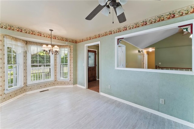 32204 Apple Hill Dr, Paola, KS 66071 - unfurnished room with wood finished floors, a chandelier, a ceiling fan, and vaulted ceiling