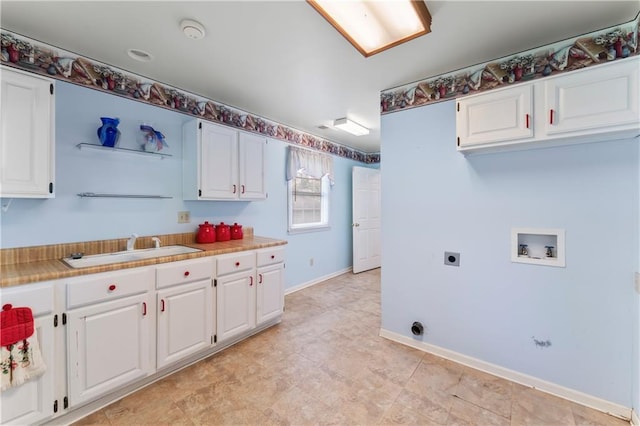 32204 Apple Hill Dr, Paola, KS 66071 - laundry area with electric dryer hookup, hookup for a washing machine, and cabinet space