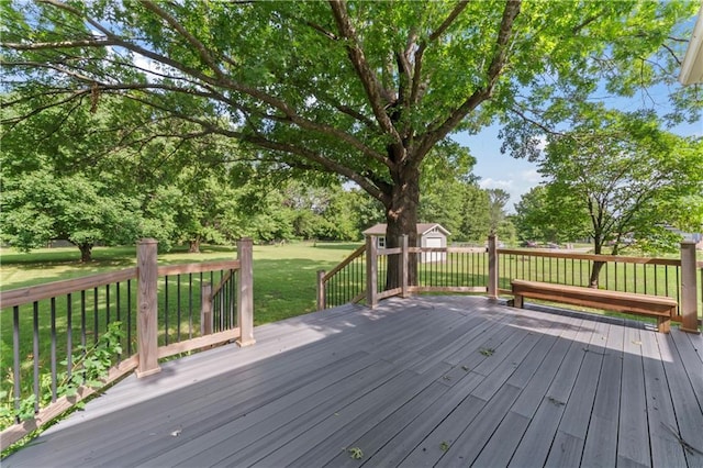 32204 Apple Hill Dr, Paola, KS 66071 - deck with a storage shed, a yard, and view of wooded area