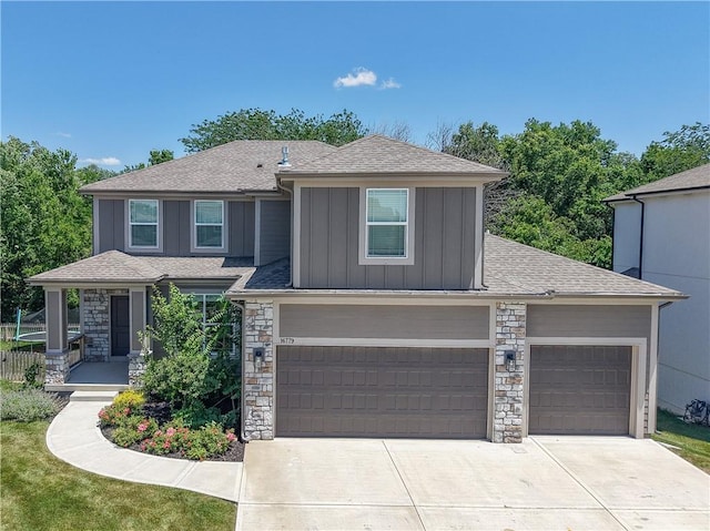 16779 S Durango St, Olathe, KS 66062 - view of front of property featuring board and batten siding, stone siding, concrete driveway, roof with shingles, and a garage