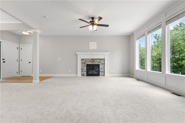 16779 S Durango St, Olathe, KS 66062 - unfurnished living room with light colored carpet, ceiling fan, and a fireplace