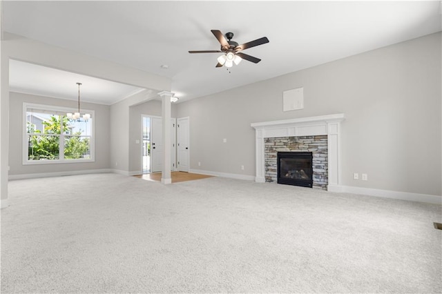 16779 S Durango St, Olathe, KS 66062 - unfurnished living room with carpet floors, a fireplace, ceiling fan, a chandelier, and crown molding