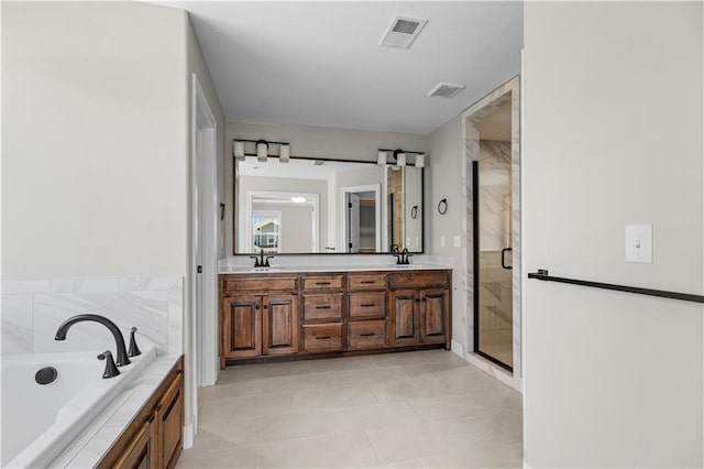 16779 S Durango St, Olathe, KS 66062 - full bathroom featuring a shower stall, double vanity, a bath, and tile patterned floors