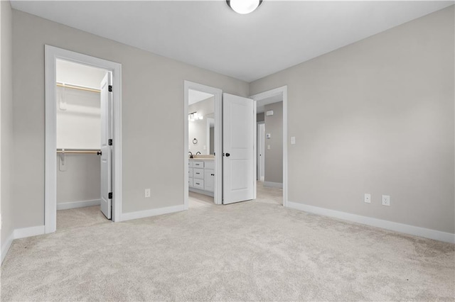 16779 S Durango St, Olathe, KS 66062 - unfurnished bedroom featuring a spacious closet, light carpet, a closet, and connected bathroom