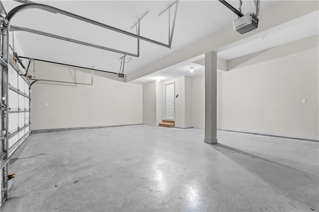 16779 S Durango St, Olathe, KS 66062 - garage featuring a garage door opener and baseboards