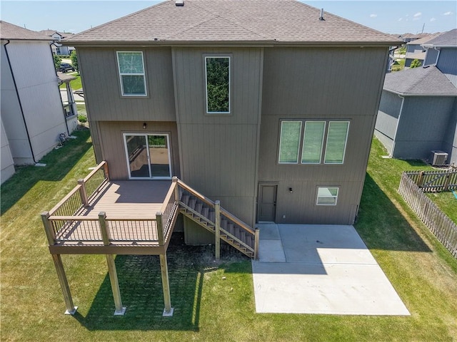 16779 S Durango St, Olathe, KS 66062 - back of property featuring a wooden deck, a shingled roof, a patio, and a fenced backyard