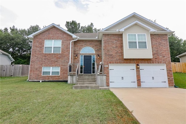 968 E Market St, Warrensburg, MO 64903 - raised ranch featuring an attached garage, driveway, and brick siding