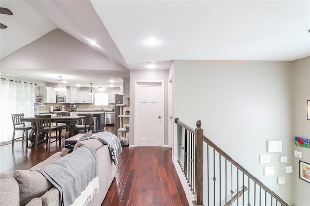 968 E Market St, Warrensburg, MO 64903 - living room with dark wood-style flooring, vaulted ceiling, and recessed lighting