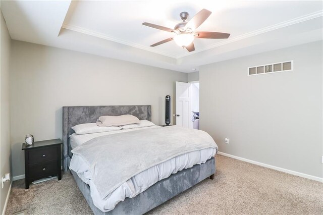 968 E Market St, Warrensburg, MO 64903 - carpeted bedroom with a raised ceiling, ornamental molding, and a ceiling fan