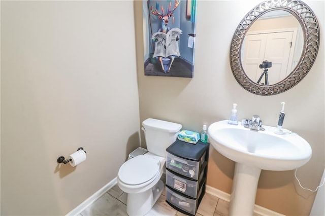 968 E Market St, Warrensburg, MO 64903 - half bath with toilet and tile patterned floors
