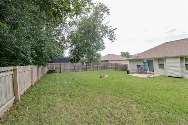 968 E Market St, Warrensburg, MO 64903 - fenced backyard featuring a patio area and a fire pit