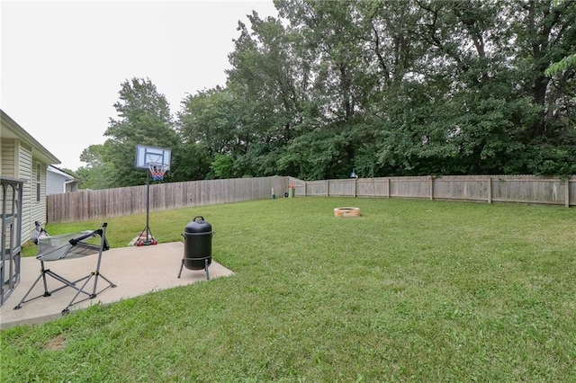 968 E Market St, Warrensburg, MO 64903 - fenced backyard with a patio area
