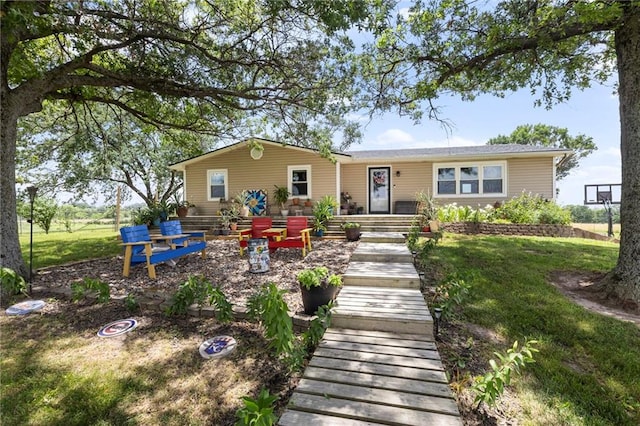 24245 K 68 Hwy, Paola, KS 66071 - rear view of house featuring a yard