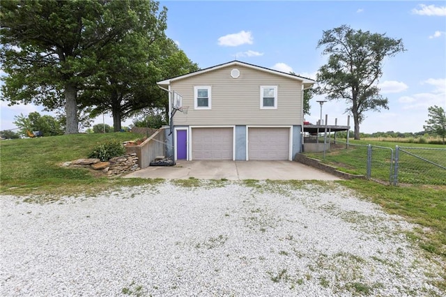 24245 K 68 Hwy, Paola, KS 66071 - view of property exterior featuring driveway and an attached garage