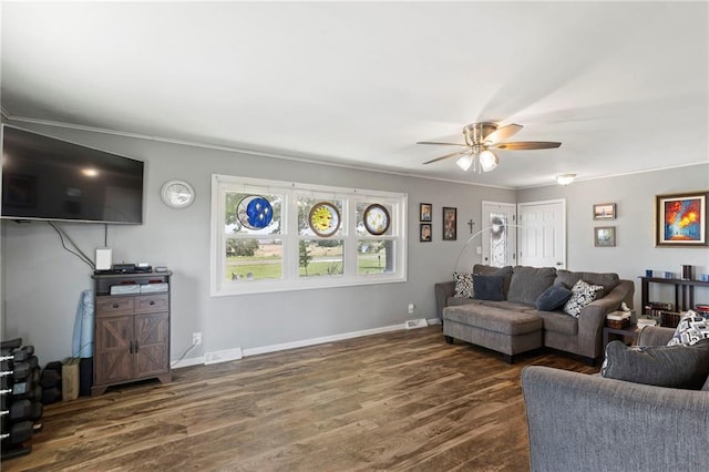 24245 K 68 Hwy, Paola, KS 66071 - living room with dark wood finished floors, plenty of natural light, ceiling fan, and ornamental molding