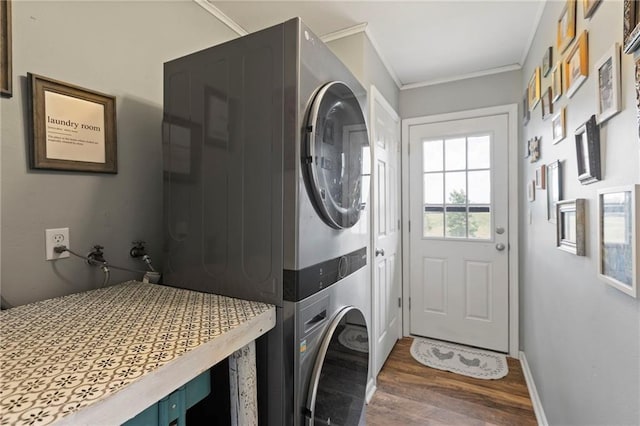 24245 K 68 Hwy, Paola, KS 66071 - laundry room featuring stacked washing machine and dryer, wood finished floors, and crown molding