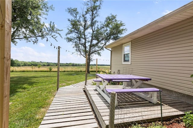 24245 K 68 Hwy, Paola, KS 66071 - deck with outdoor dining area, a yard, and a rural view