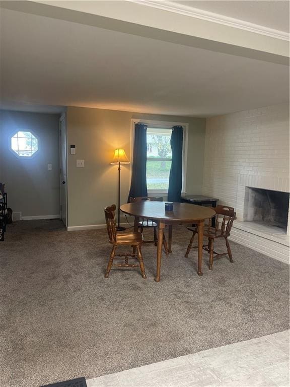 400 N Institute St, Richmond, MO 64085 - dining room with carpet flooring, a fireplace, and plenty of natural light
