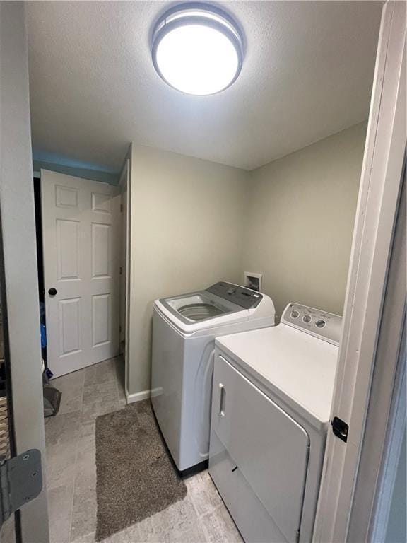 400 N Institute St, Richmond, MO 64085 - washroom with washing machine and clothes dryer and a textured ceiling