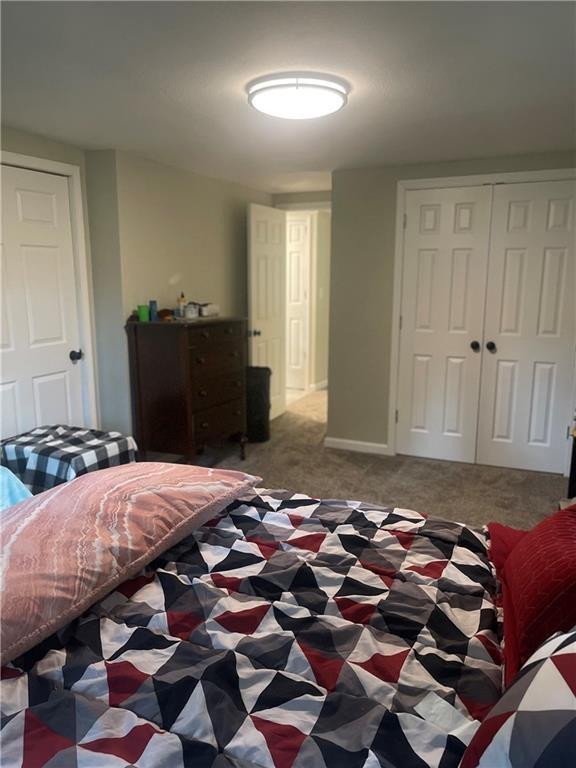 400 N Institute St, Richmond, MO 64085 - carpeted bedroom with a closet