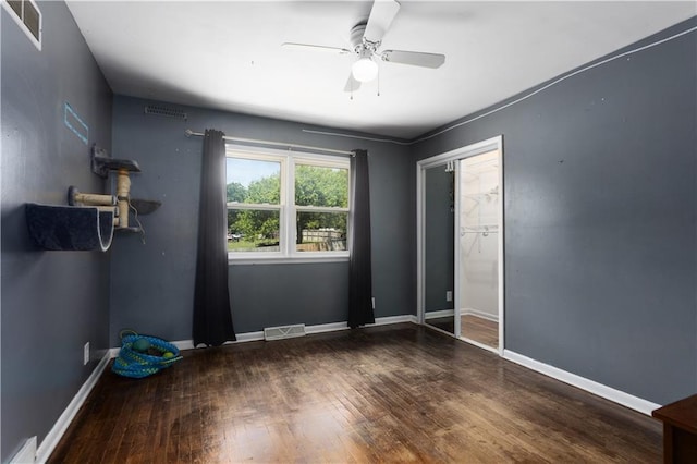 820 S Main St, Lansing, KS 66043 - unfurnished bedroom with wood finished floors and ceiling fan