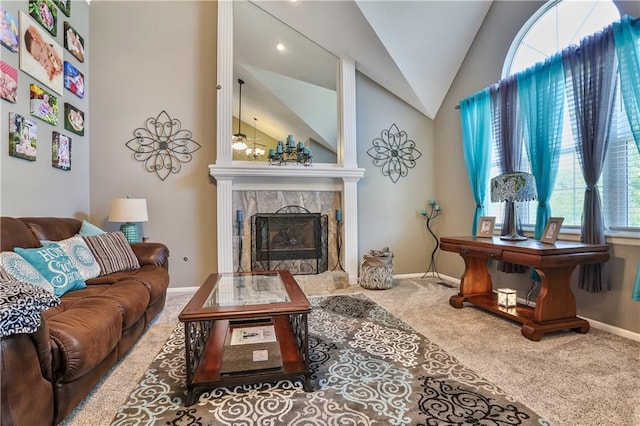 1641 N Hunter Dr, Olathe, KS 66061 - carpeted living area featuring lofted ceiling and a tiled fireplace