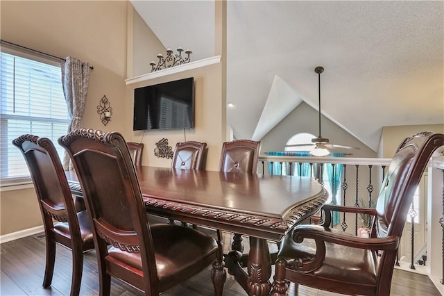 1641 N Hunter Dr, Olathe, KS 66061 - dining space with vaulted ceiling, a ceiling fan, and wood finished floors