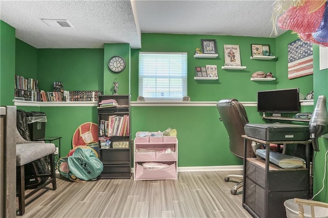 1641 N Hunter Dr, Olathe, KS 66061 - office area with a textured ceiling and wood finished floors