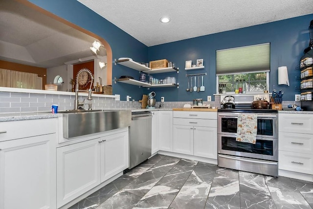 118 SE 215th Rd, Warrensburg, MO 64093 - kitchen with appliances with stainless steel finishes, recessed lighting, white cabinets, tasteful backsplash, and open shelves