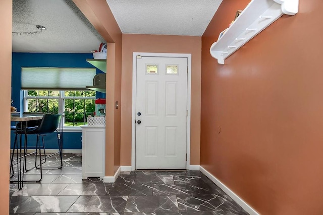 118 SE 215th Rd, Warrensburg, MO 64093 - foyer with a textured ceiling and marble finish floors