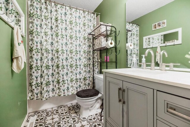 118 SE 215th Rd, Warrensburg, MO 64093 - full bathroom featuring vanity, a textured ceiling, a shower with curtain, and tile patterned floors