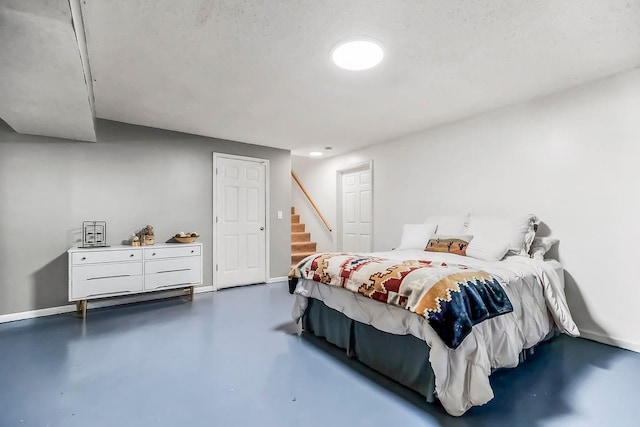 118 SE 215th Rd, Warrensburg, MO 64093 - bedroom featuring concrete floors and baseboards