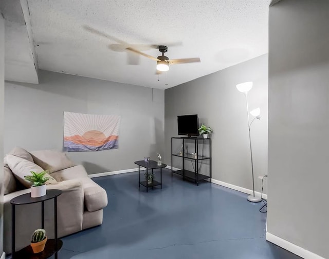 118 SE 215th Rd, Warrensburg, MO 64093 - living area with a ceiling fan, concrete floors, and a textured ceiling