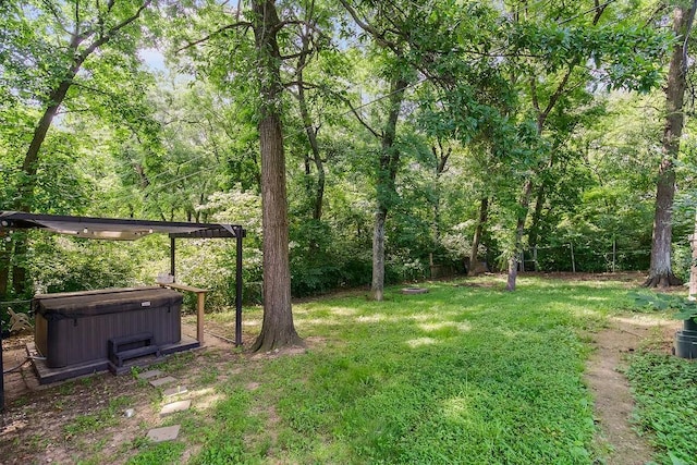 118 SE 215th Rd, Warrensburg, MO 64093 - view of grassy yard featuring a hot tub and a wooded view