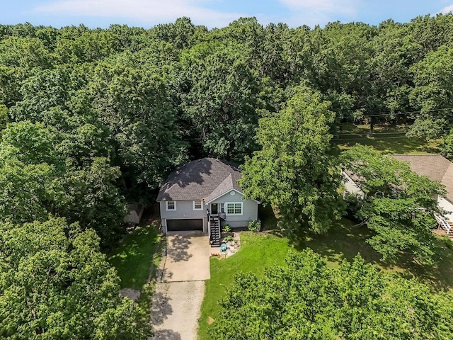 118 SE 215th Rd, Warrensburg, MO 64093 - aerial view of property and surrounding area featuring a heavily wooded area