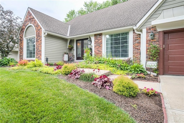 8404 Rosehill Rd, Lenexa, KS 66215 - view of front of house featuring a shingled roof, a front yard, a garage, brick siding, and driveway