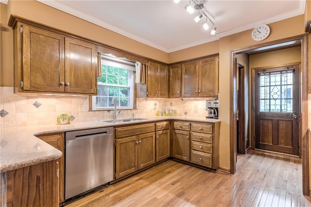 8404 Rosehill Rd, Lenexa, KS 66215 - kitchen featuring stainless steel dishwasher, light wood-style floors, brown cabinetry, light stone counters, and tasteful backsplash