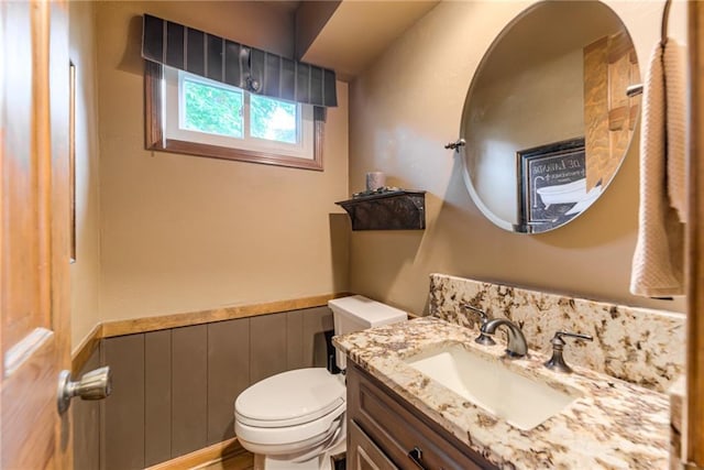 8404 Rosehill Rd, Lenexa, KS 66215 - bathroom featuring vanity and a wainscoted wall