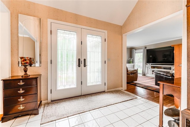 8404 Rosehill Rd, Lenexa, KS 66215 - entryway with vaulted ceiling, light tile patterned floors, and french doors