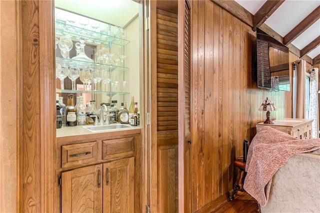 8404 Rosehill Rd, Lenexa, KS 66215 - indoor wet bar featuring wood walls and wood finished floors