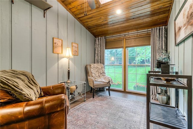 8404 Rosehill Rd, Lenexa, KS 66215 - sitting room with wooden ceiling, vaulted ceiling, a skylight, and wood finished floors