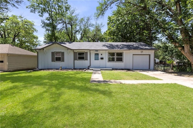 8918 Switzer St, Overland Park, KS 66214 - ranch-style house with concrete driveway and a garage
