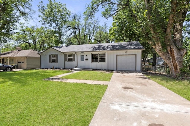 8918 Switzer St, Overland Park, KS 66214 - view of front facade featuring an attached garage and concrete driveway