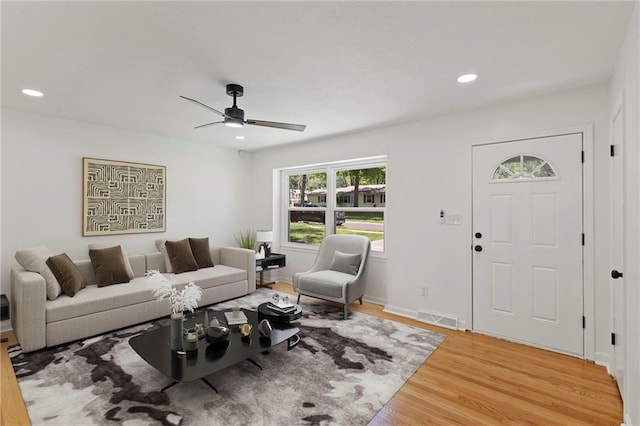 8918 Switzer St, Overland Park, KS 66214 - living area with light wood-style floors, plenty of natural light, a ceiling fan, and recessed lighting