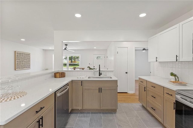 8918 Switzer St, Overland Park, KS 66214 - kitchen featuring stainless steel appliances, ceiling fan, light countertops, recessed lighting, and backsplash