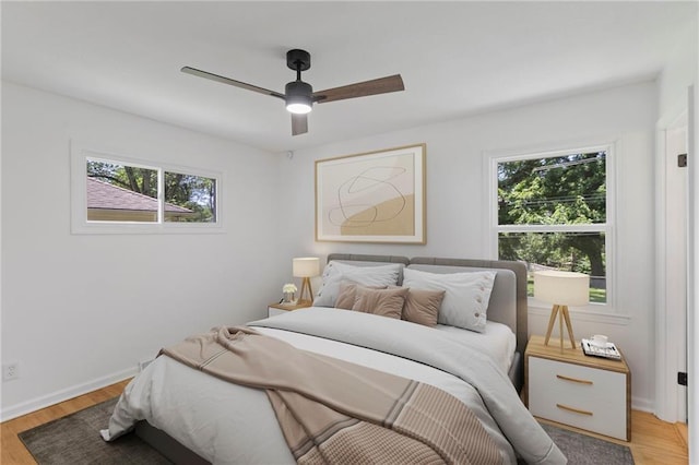 8918 Switzer St, Overland Park, KS 66214 - bedroom featuring light wood-style floors and a ceiling fan